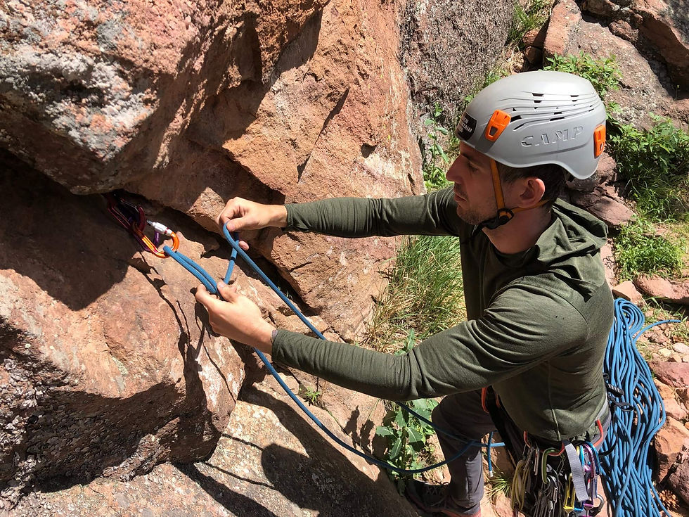 A climber practicing tying knots in Eldorado Canyon State Park