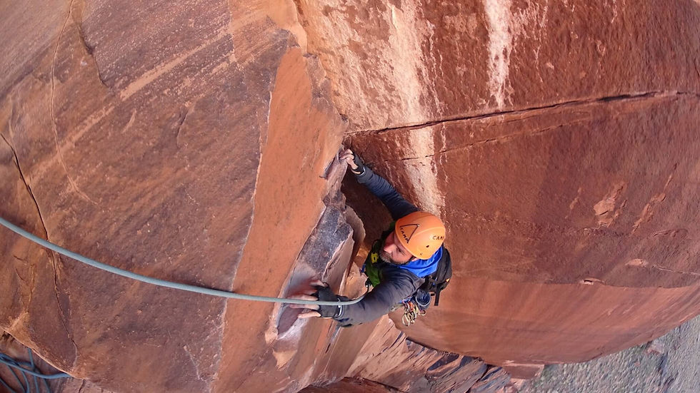 Climbing the crux pitch of Lighthouse Tower in Moab Utah