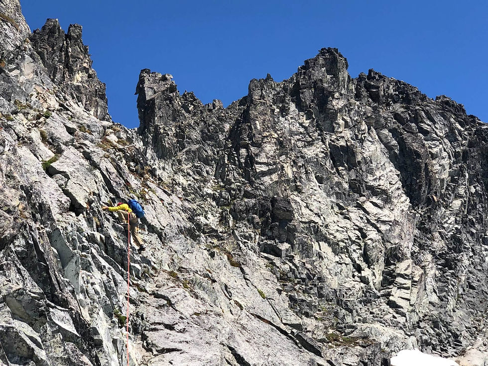 Alpine climber rock climbing