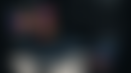 Laptop with colorful charts, phone showing monthly spend of $2,375, receipts, and cost-of-living doodles on black background.