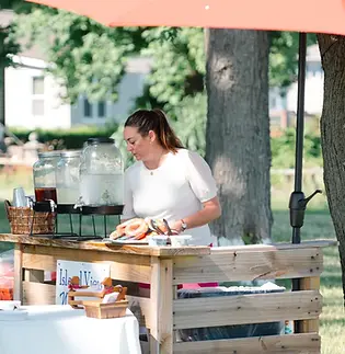 3rd generation operator, Jessica, sets up outdoor bar - Photo by Darllane
