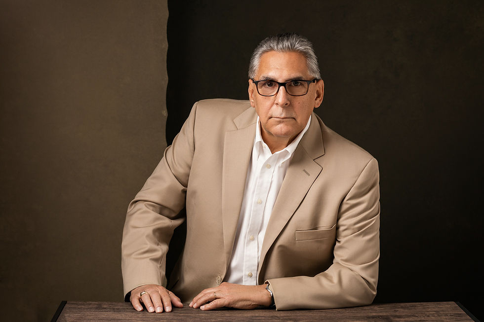 Man in a beige suit and glasses in Los Angeles portrait studio