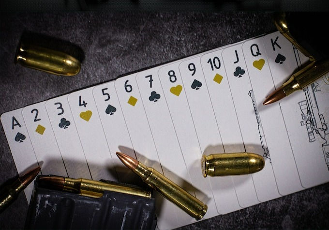 Thumbnail: Arms Dealer (Gilded) Playing Cards by Nick Belcher