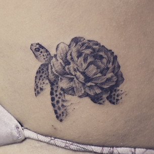 Best minimal turtle tattoo with flower at Baan Khagee Tattoo Chiang Mai, Thailand