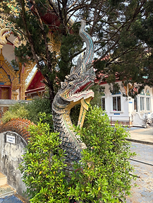 Thai Naga statue in front of Buildinguddhist building