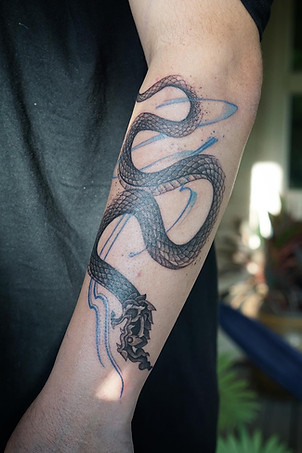 Best Blackwork Thai Naga tattoo with abstract flow by Baan Khagee Tattoo Chiang Mai, Thailand