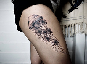 Best Blackwork jellyfish tattoo with Plumeria flower at Baan Khagee Tattoo Chiang Mai, Thailand