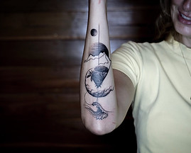 Best Blackwork abstract nature tattoo on forearm at Baan Khagee Tattoo Chiang Mai, Thailand