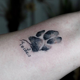 Best Minimal dog paw tattoo at Baan Khagee Tattoo Chiang Mai, Thailand