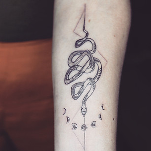 Best Fine line snake tattoo with geometric lines at Baan Khagee Tattoo Chiang Mai, Thailand