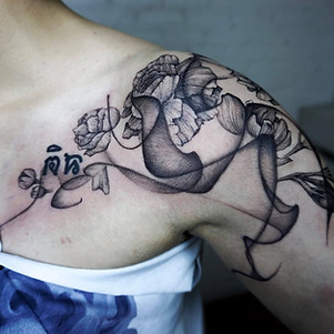 Best Blackwork Jasmine flowers with abstract flow by a blackwork tattoo artist in Chiang Mai, Thailand