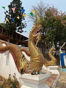 Thai Naga statue in front of Buildinguddhist building