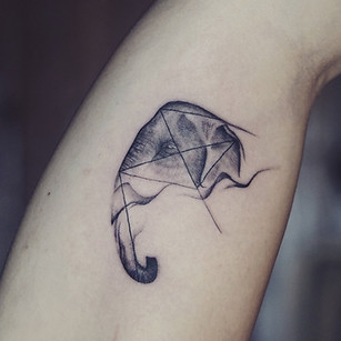 Best Minimal elephant tattoo with geometric fine lines at Baan Khagee Tattoo Chiang Mai, Thailand