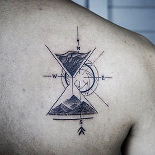 Best Geometric fine line hourglass tattoo with abstract flow at Baan Khagee Tattoo Chiang Mai, Thailand