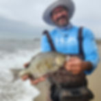 David Wrenn holding a big Barred Surf Perch.