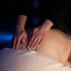 Hands providing a back massage