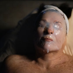 Close-up of a woman receiving a recovery facial