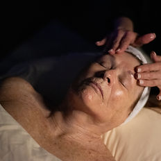 Woman receiving a facial treatment