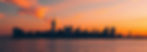 navy blue skyline on orange sky, reflecting on water_edited_edited.jpg