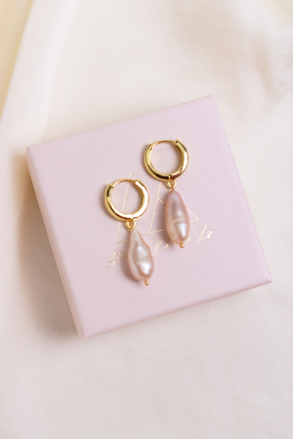 Thumbnail: Long Pink Pearl Charm Creole Earring