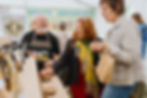 Visitors buying fudge in the producer tent at Penzance Food Festival