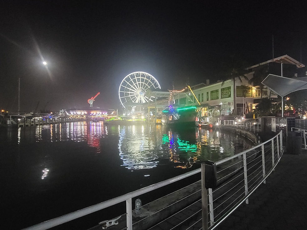The moon over Bayside Market Place in Miami, Florida