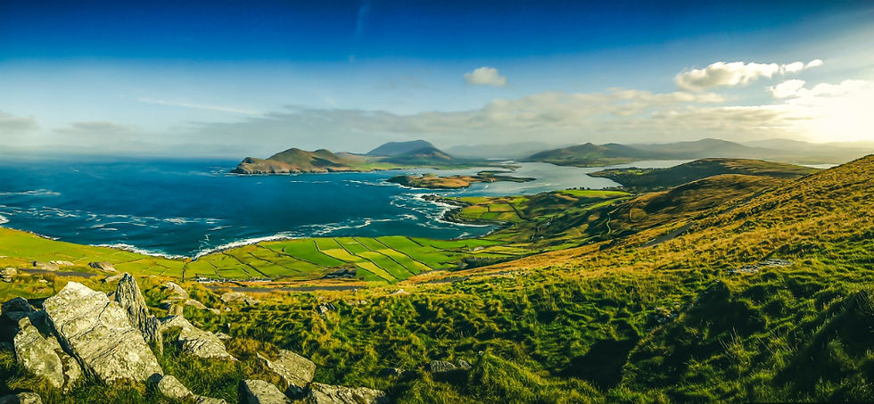 Fantastic panorama view of the green hills of County Kerry and the Ring of Kerry, rolling into the sea in Ireland