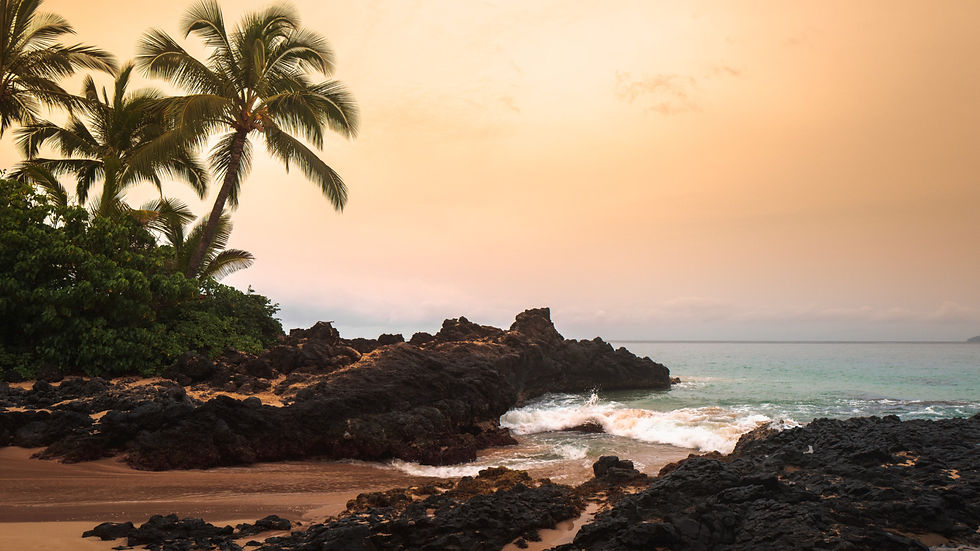Waves crashing onto the sand shore of Maui's Makena Cove, the secret beach between rocky outcroppings now popular with couples for the wedding and honeymoon photos