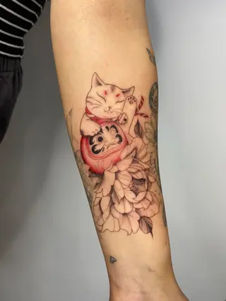 Lucky cat and daruma with flowers illustrative and fine line tattoo