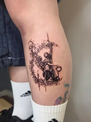 angel with blackwork tattoo