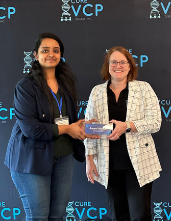 Shruthi receiving an award for her research presentation at the 2024 VCP International Scientific Co