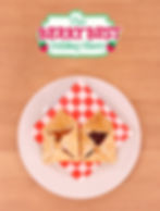 Small strawberry pies on a red and white gingham napkin.