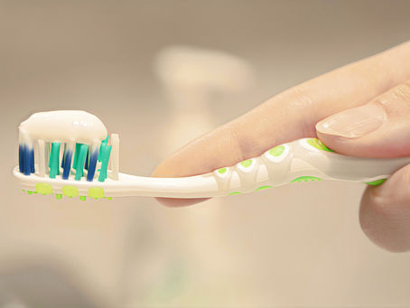 toothbrush with toothpaste on it