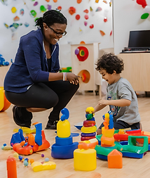 A young adult caregiver supporting a child in school