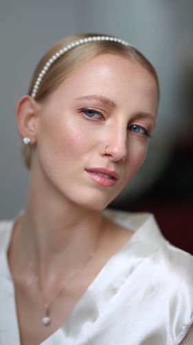 Bridal makeup and hair showcasing a natural, soft glam look by Ieva Genovesi