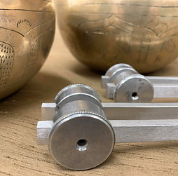 Tibetan singing bowls with tuning forks.