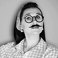 Woman wearing fake mustache