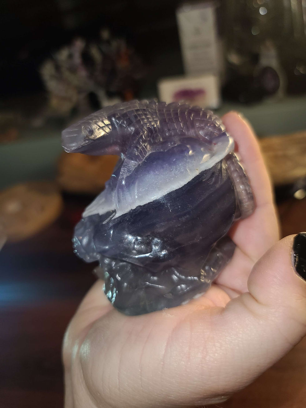 Thumbnail: Rainbow fluorite lizard on human skull crystal carving