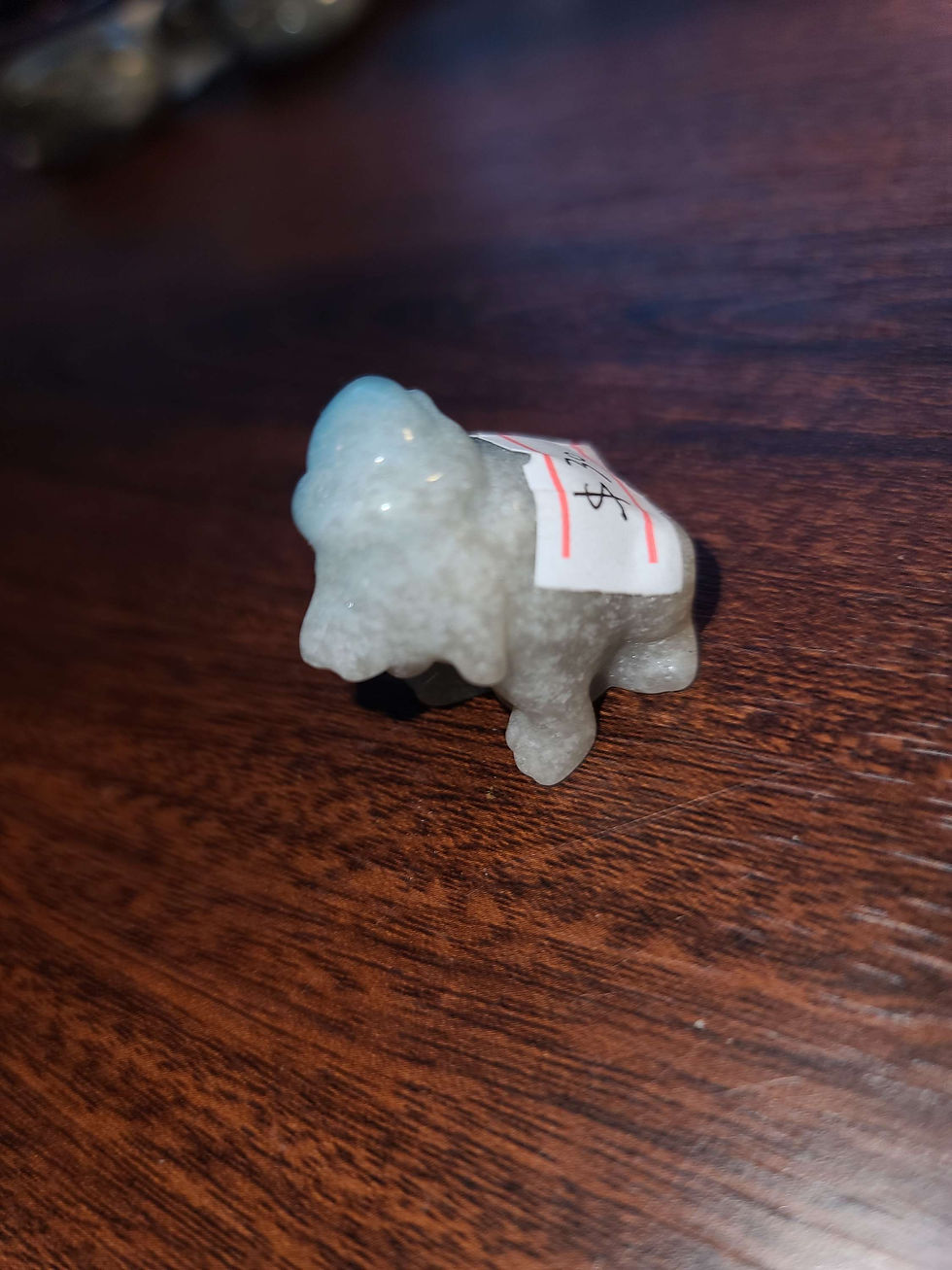 Thumbnail: Troilite crystal puppy dog with hat on animal carving