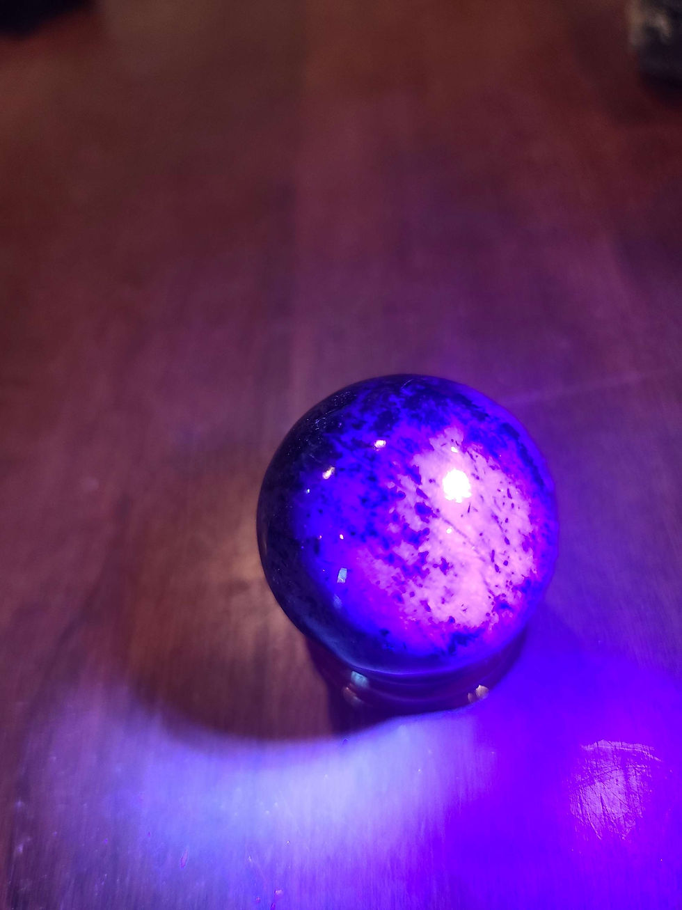 Thumbnail: UV reactive deep purple charoite sphere