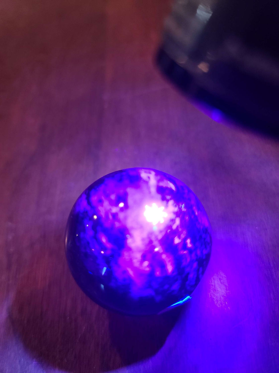 Thumbnail: UV reactive deep purple charoite sphere