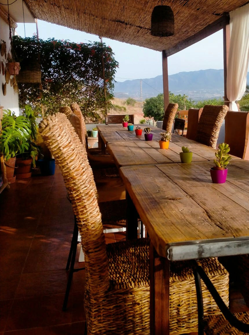 Thumbnail: Communal dining area Shared outdoor dining space where nourishing meals are served and heartfelt conversations unfold.