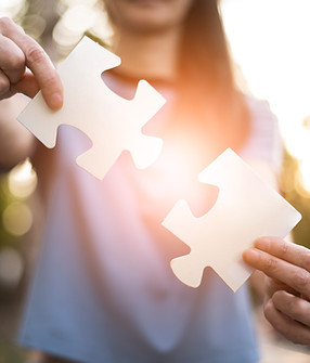 front-view-woman-holding-puzzle-pieces.jpg