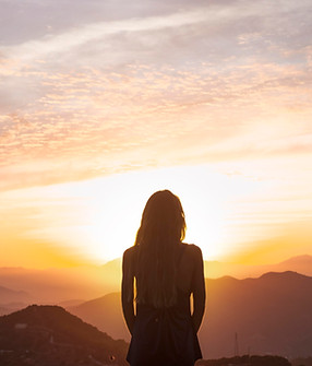back-view-woman-doing-yoga-while-watching-sunset.jpg