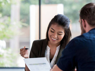 Lady speaking to a man about loans