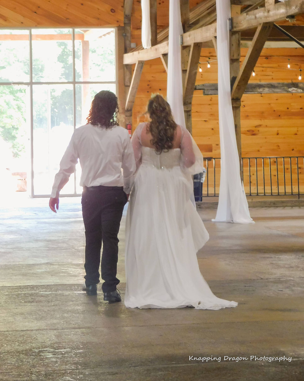 Close-up view of a wedding album with artistic light painting photos