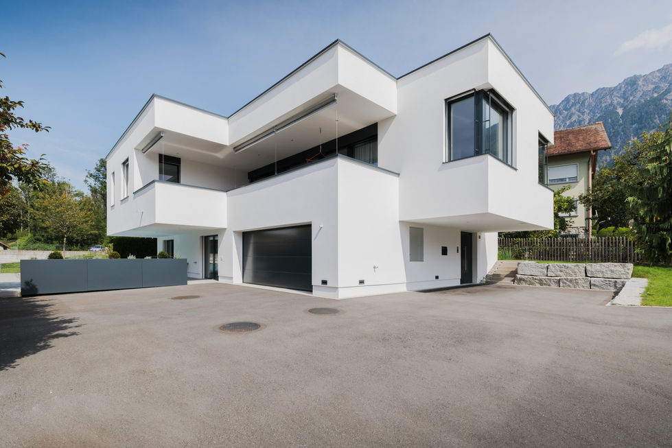 Einfamilienhaus mit Puztfassade und Übereckverglasung
