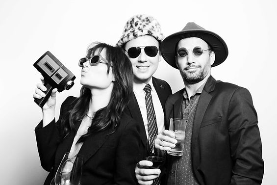 Social event photo booth moment with guests interacting