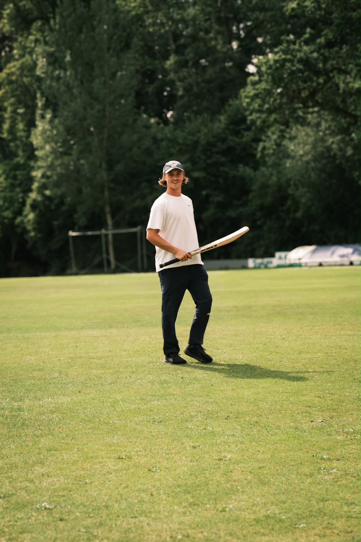 Lachie on the field with a cricket bat