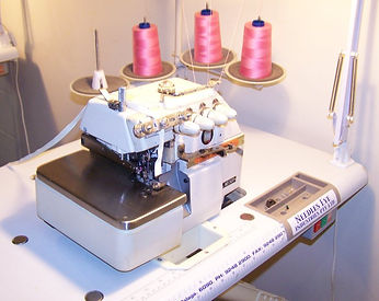 industrial overlocker with elastic tensioner